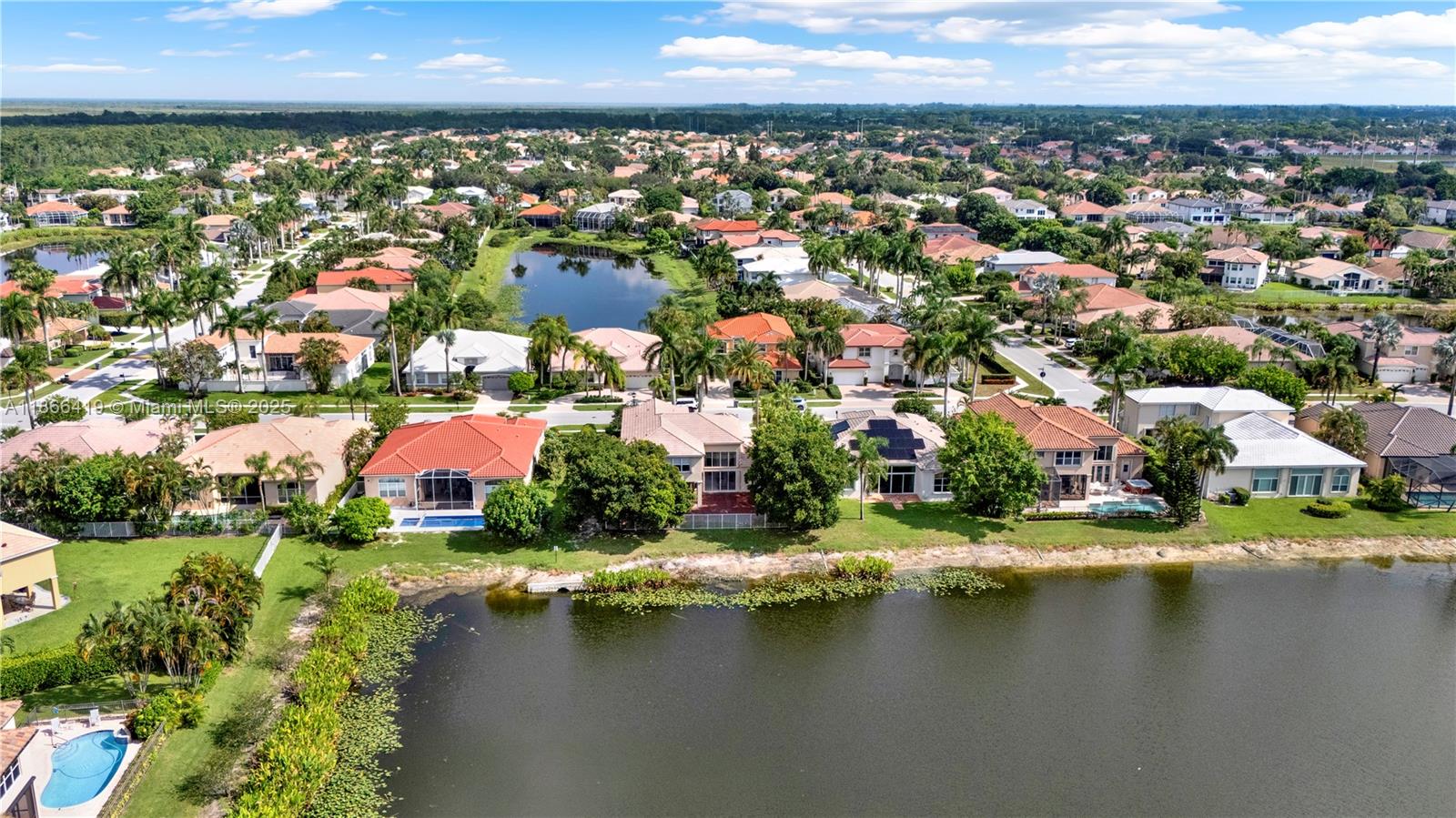 18708 Ocean Mist Drive Boca Raton, FL 33498 - Photo 54 of 58 an aerial view of residential houses with outdoor space and lake view