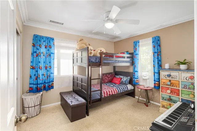 a bedroom with furniture and a book shelf