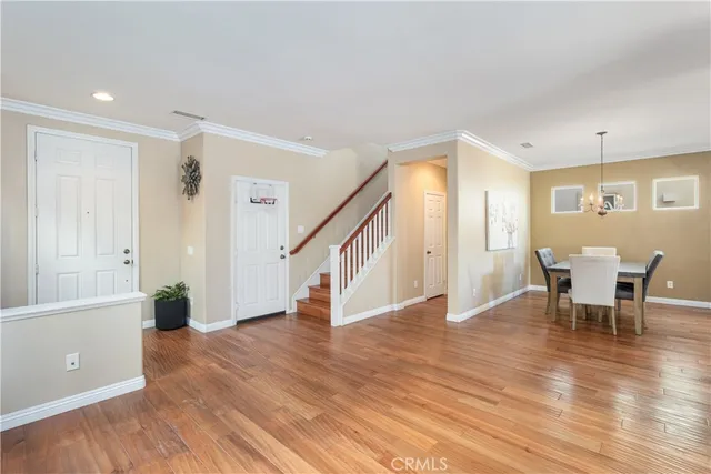 a view of a livingroom with furniture and wooden floor