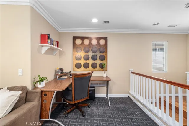 a workspace with furniture and window