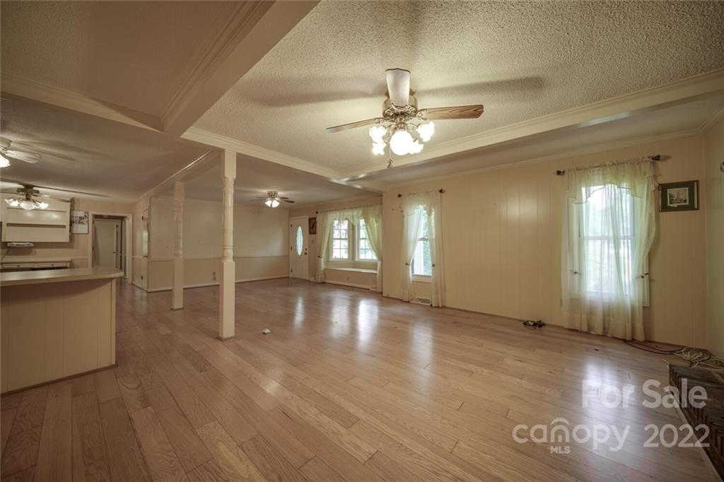 699 Bailey Road Lancaster, SC 29720 - Photo 2 of 43 a view of an empty room with window and wooden floor