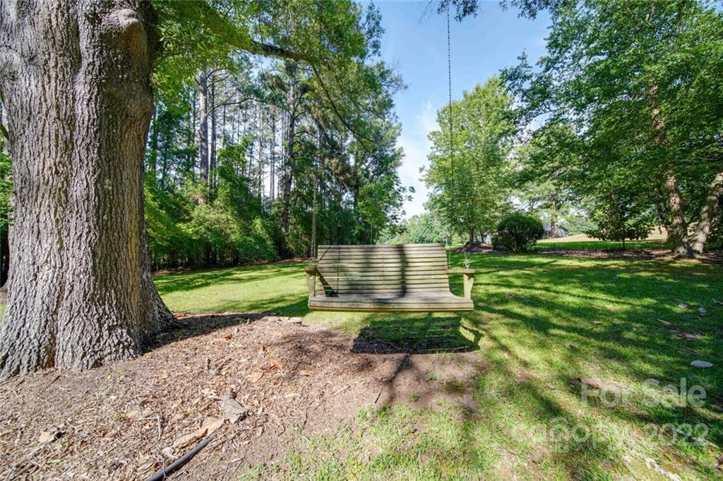 699 Bailey Road Lancaster, SC 29720 - Photo 35 of 43 a view of a park with plants and a bench