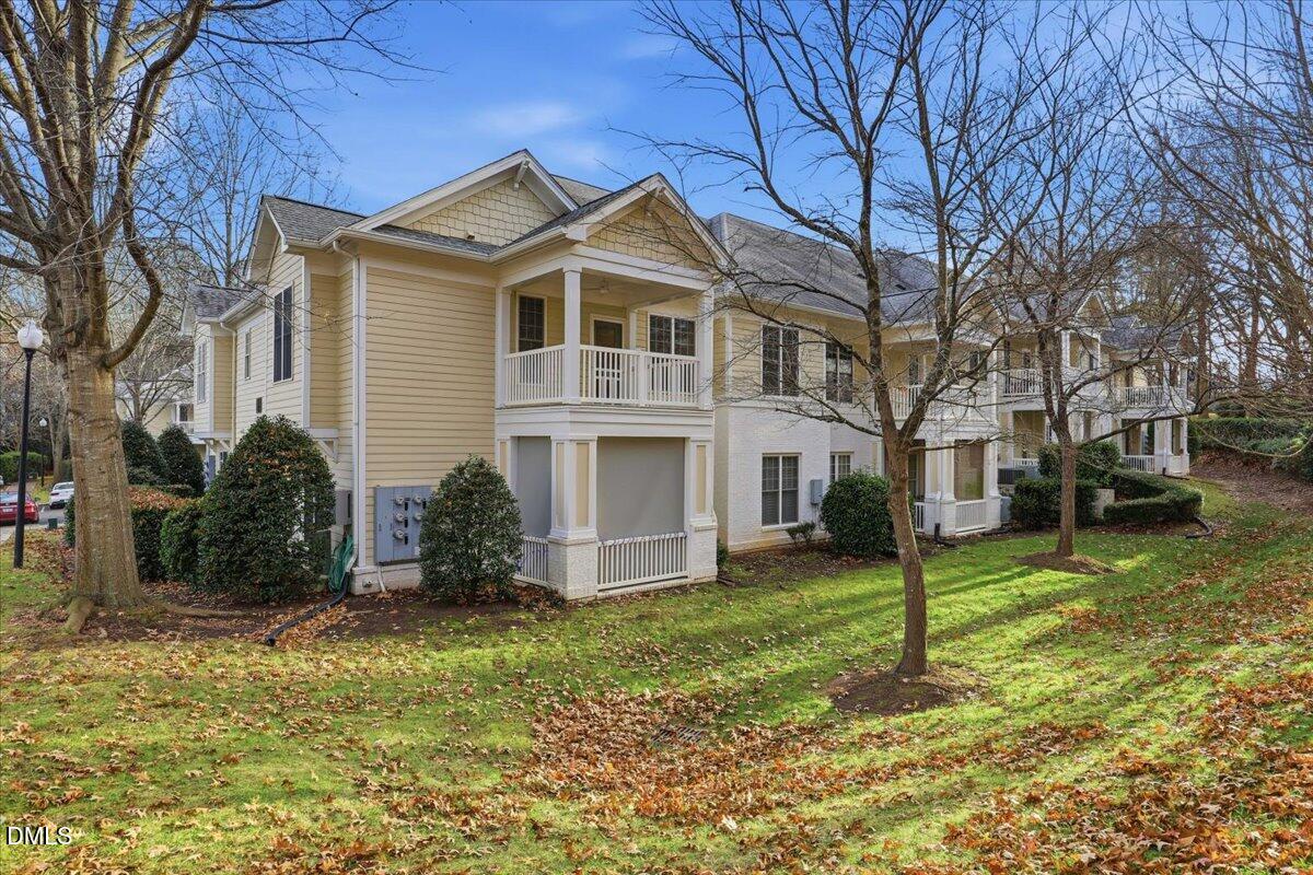 1301 Durlain Drive, Unit 208 Raleigh, NC 27614 - Photo 3 of 31 a front view of a house with a yard