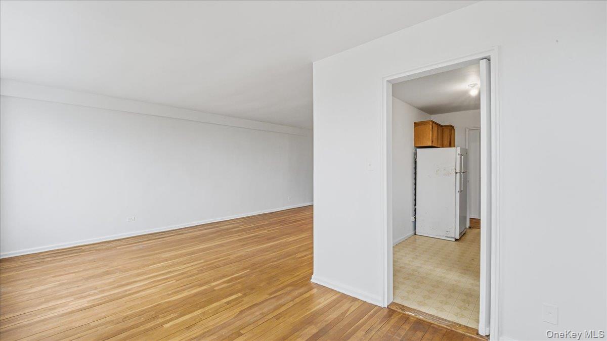 210-15 23rd Avenue, Unit 3F Queens, NY 11360 - Photo 13 of 24 wooden floor in a room