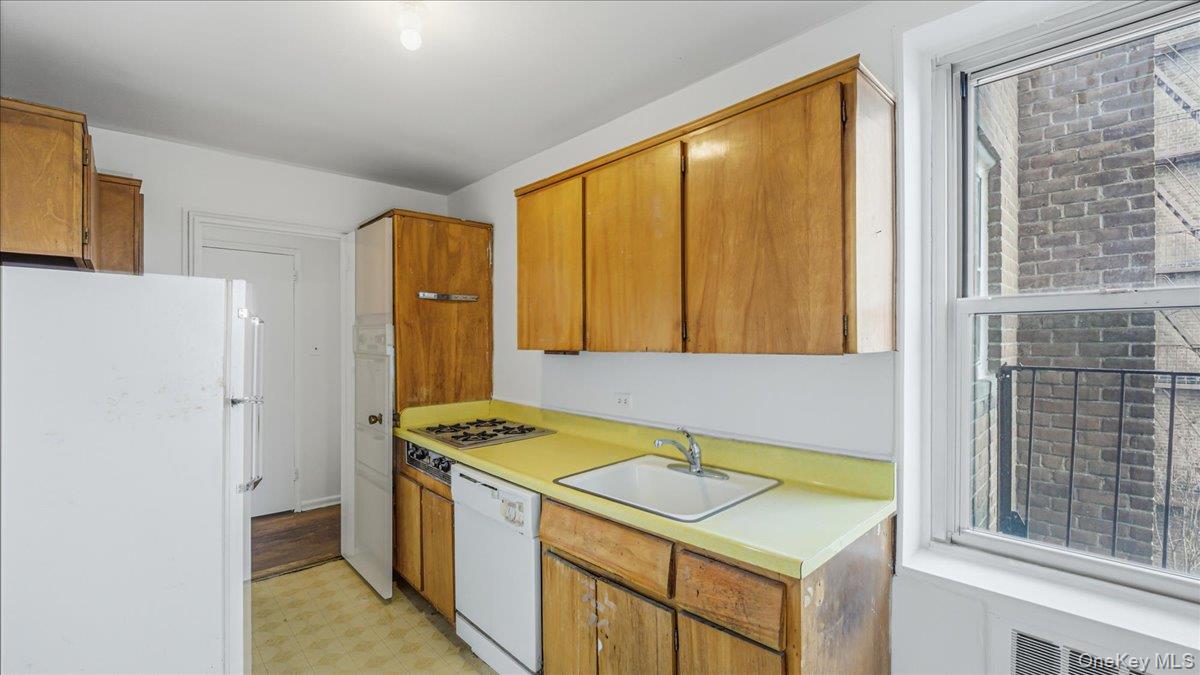 210-15 23rd Avenue, Unit 3F Queens, NY 11360 - Photo 14 of 24 a utility room with washer and dryer