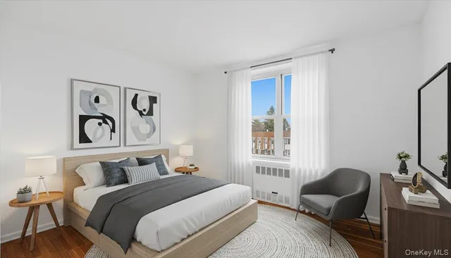 a bedroom with bed and window