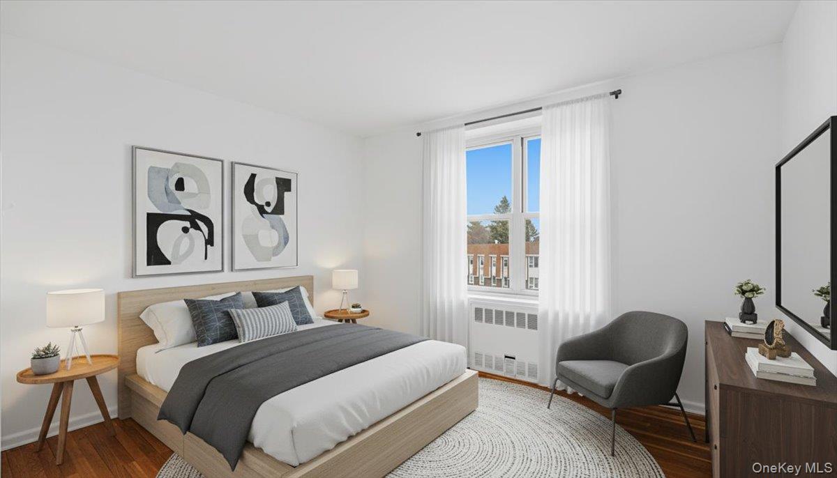 210-15 23rd Avenue, Unit 3F Queens, NY 11360 - Photo 18 of 24 a bedroom with bed and window