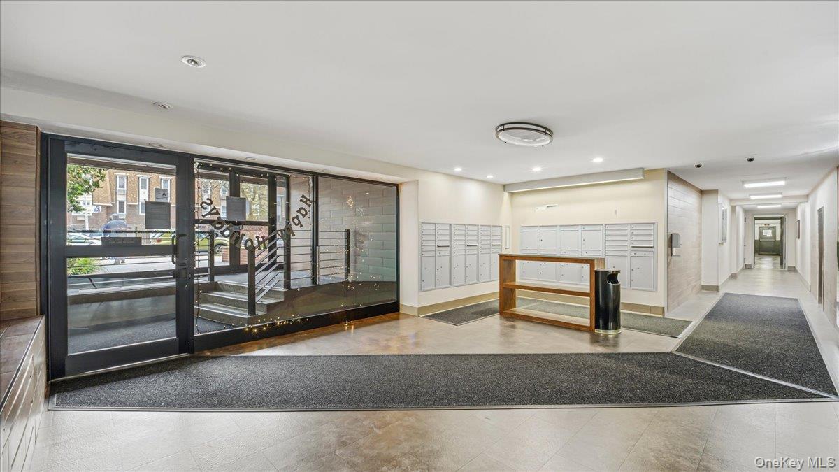 210-15 23rd Avenue, Unit 3F Queens, NY 11360 - Photo 23 of 24 a living room with furniture