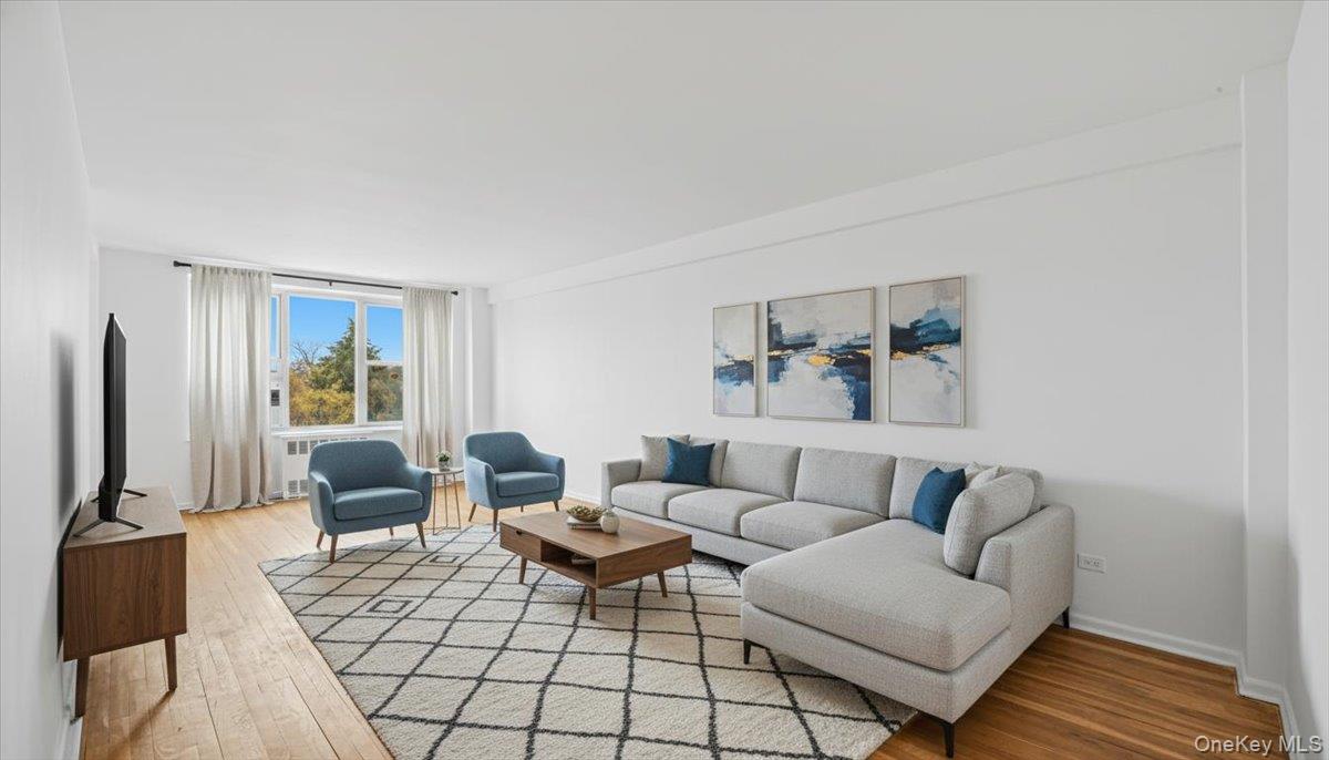 210-15 23rd Avenue, Unit 3F Queens, NY 11360 - Photo 5 of 24 a living room with furniture