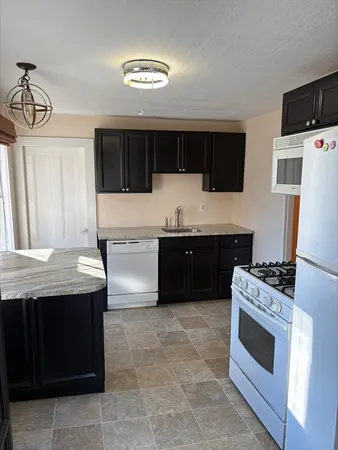a kitchen with a stove and a microwave