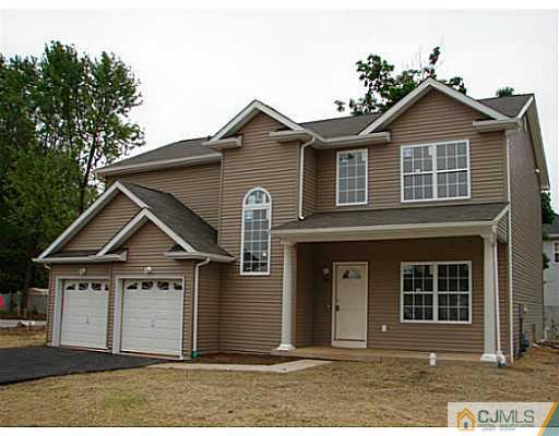 963 Clark Road North Brunswick, NJ 08902 - Photo 1 of 6 front view of a house with a yard