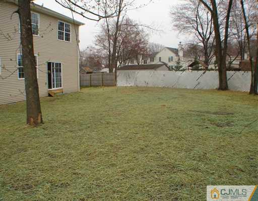 963 Clark Road North Brunswick, NJ 08902 - Photo 2 of 6 a view of a yard with brick wall