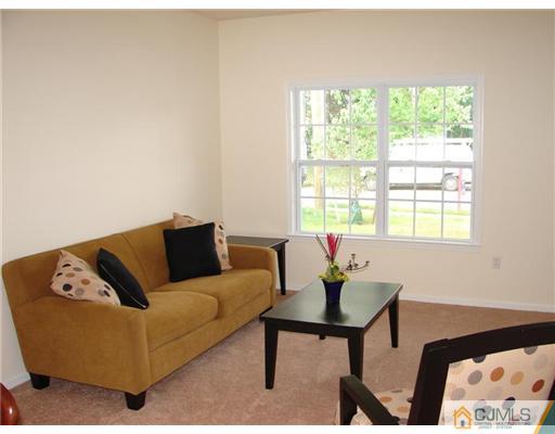 963 Clark Road North Brunswick, NJ 08902 - Photo 3 of 6 a living room with furniture and a window