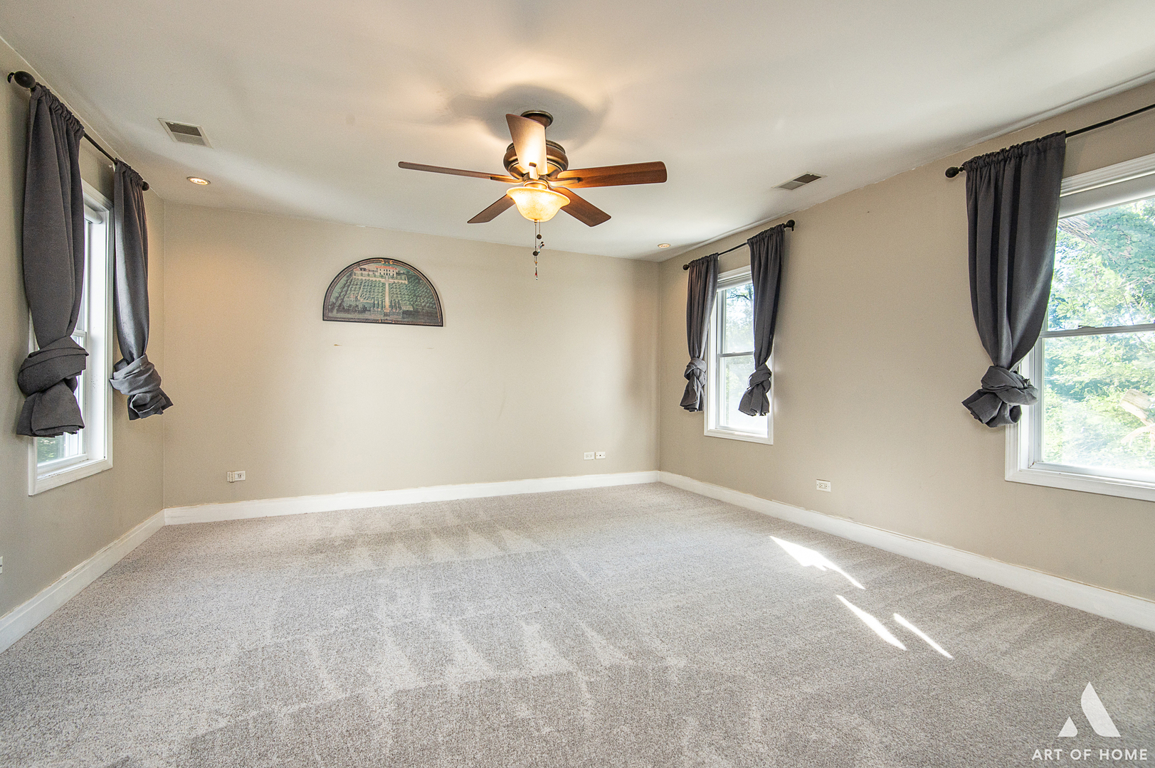 8813 Wolf Road Burr Ridge, IL 60527 - Photo 14 of 34 an empty room with windows and fan