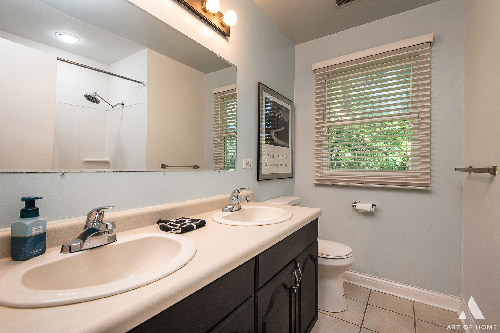8813 Wolf Road Burr Ridge, IL 60527 - Photo 20 of 34 a bathroom with a double vanity sink toilet and a mirror