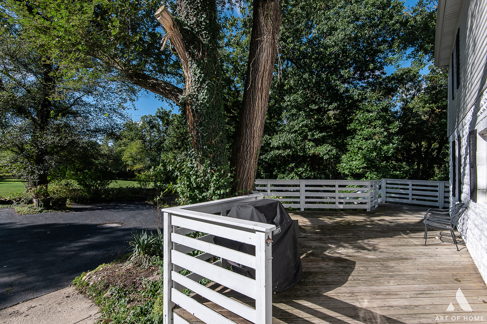 8813 Wolf Road Burr Ridge, IL 60527 - Photo 30 of 34 a view of a patio with chairs and wooden fence