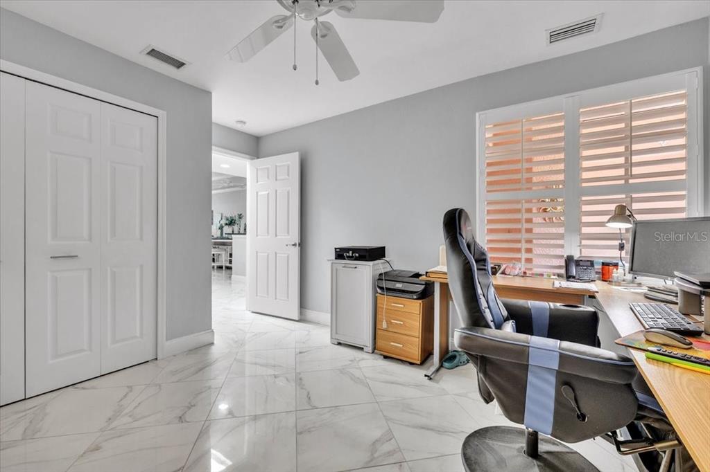 1260 Rio De Janeiro Avenue, Unit 102 Punta Gorda, FL 33983 - Photo 29 of 46 a view of a workspace with furniture and a window