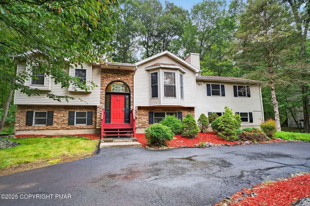 front view of a house with a yard