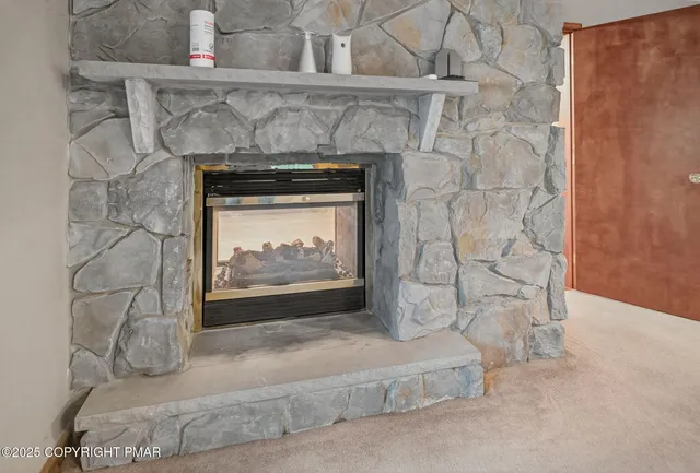 a living room with a fireplace