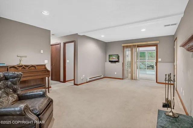 a livingroom with furniture and a window