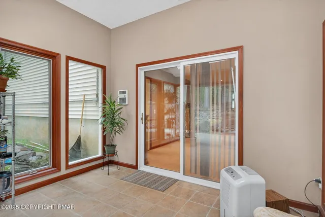 a view of a livingroom with furniture and windows