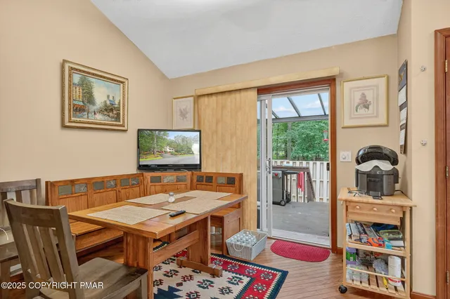 a reading room with furniture a rug and a window