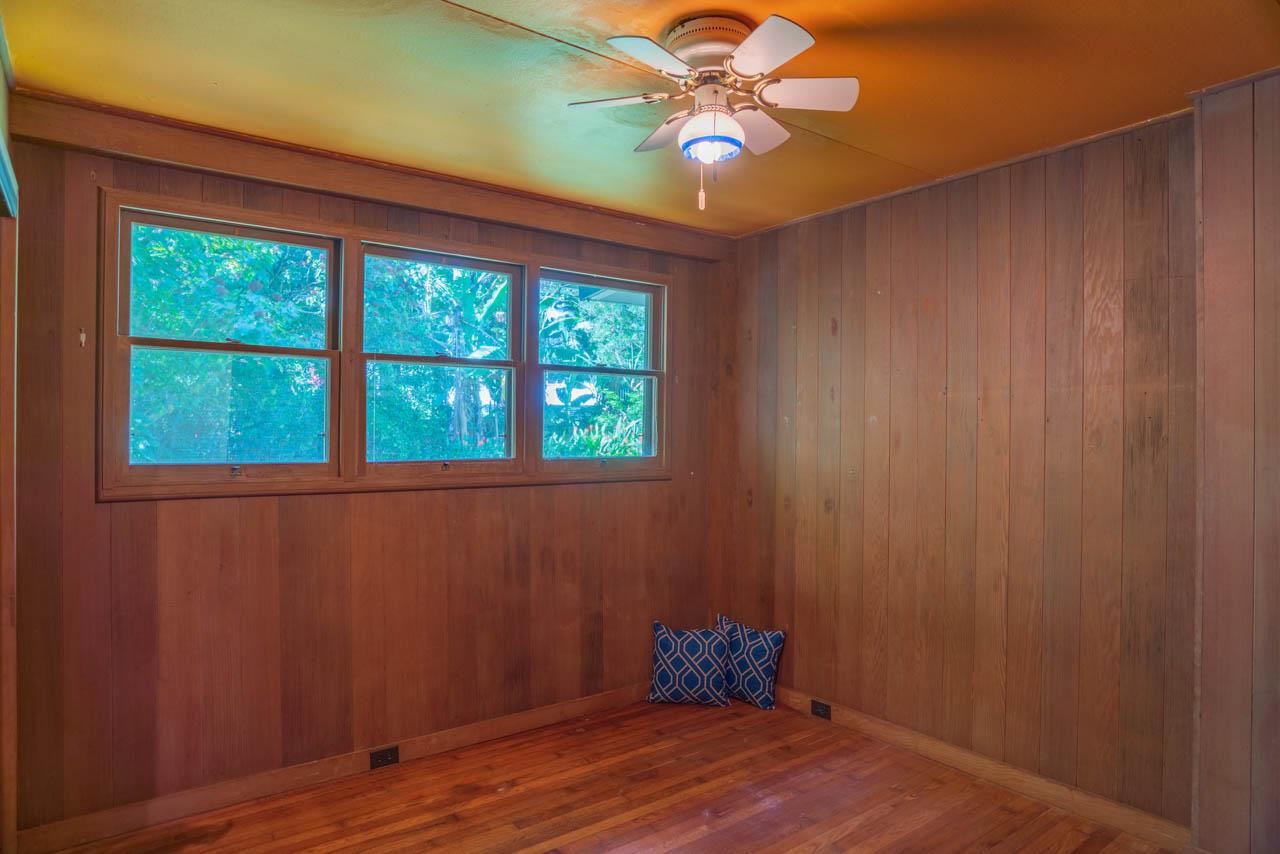373 Ulumalu Road Haiku, HI 96708 - Photo 11 of 30 an empty room with a window and wooden floor