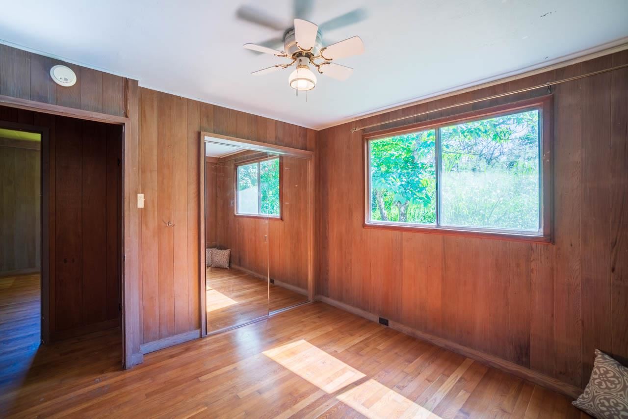 373 Ulumalu Road Haiku, HI 96708 - Photo 14 of 30 wooden floor in an empty room with a window