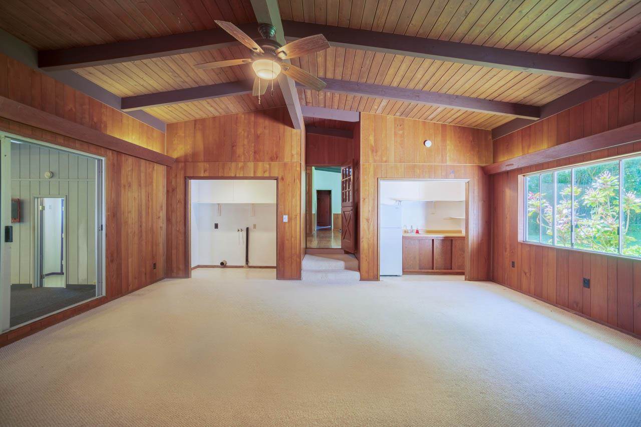 373 Ulumalu Road Haiku, HI 96708 - Photo 25 of 30 a view of an empty room with a fireplace and a window