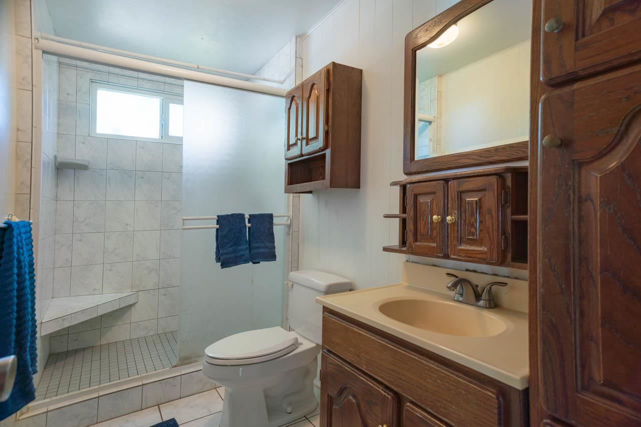 373 Ulumalu Road Haiku, HI 96708 - Photo 10 of 30 a bathroom with a sink a toilet and a mirror