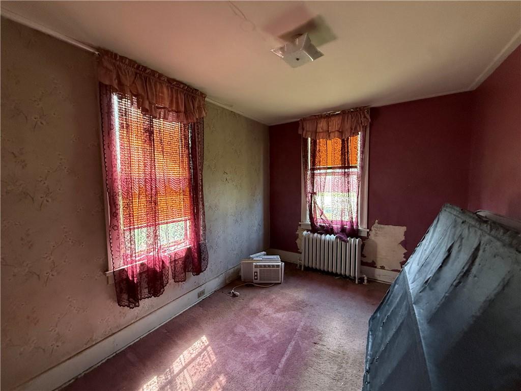 12 Connor Street Uniontown, PA 15401 - Photo 11 of 15 a living room with furniture and a window