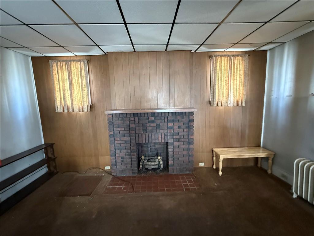 12 Connor Street Uniontown, PA 15401 - Photo 7 of 15 a living room with furniture and a fireplace