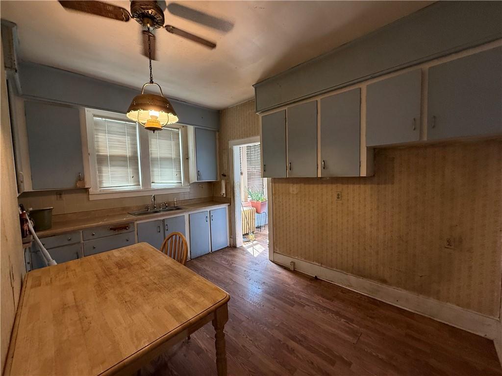12 Connor Street Uniontown, PA 15401 - Photo 9 of 15 a kitchen with a wooden floor and a view of living room