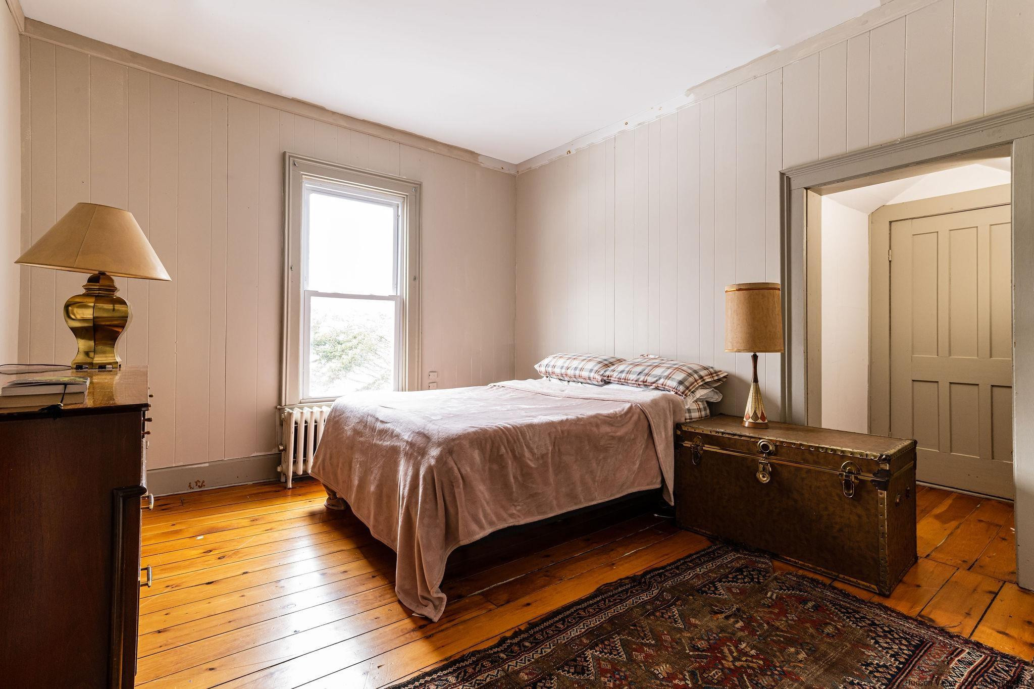 54155 Main Street Roxbury, NY 12474 - Photo 11 of 20 a bed room with a bed and a dresser