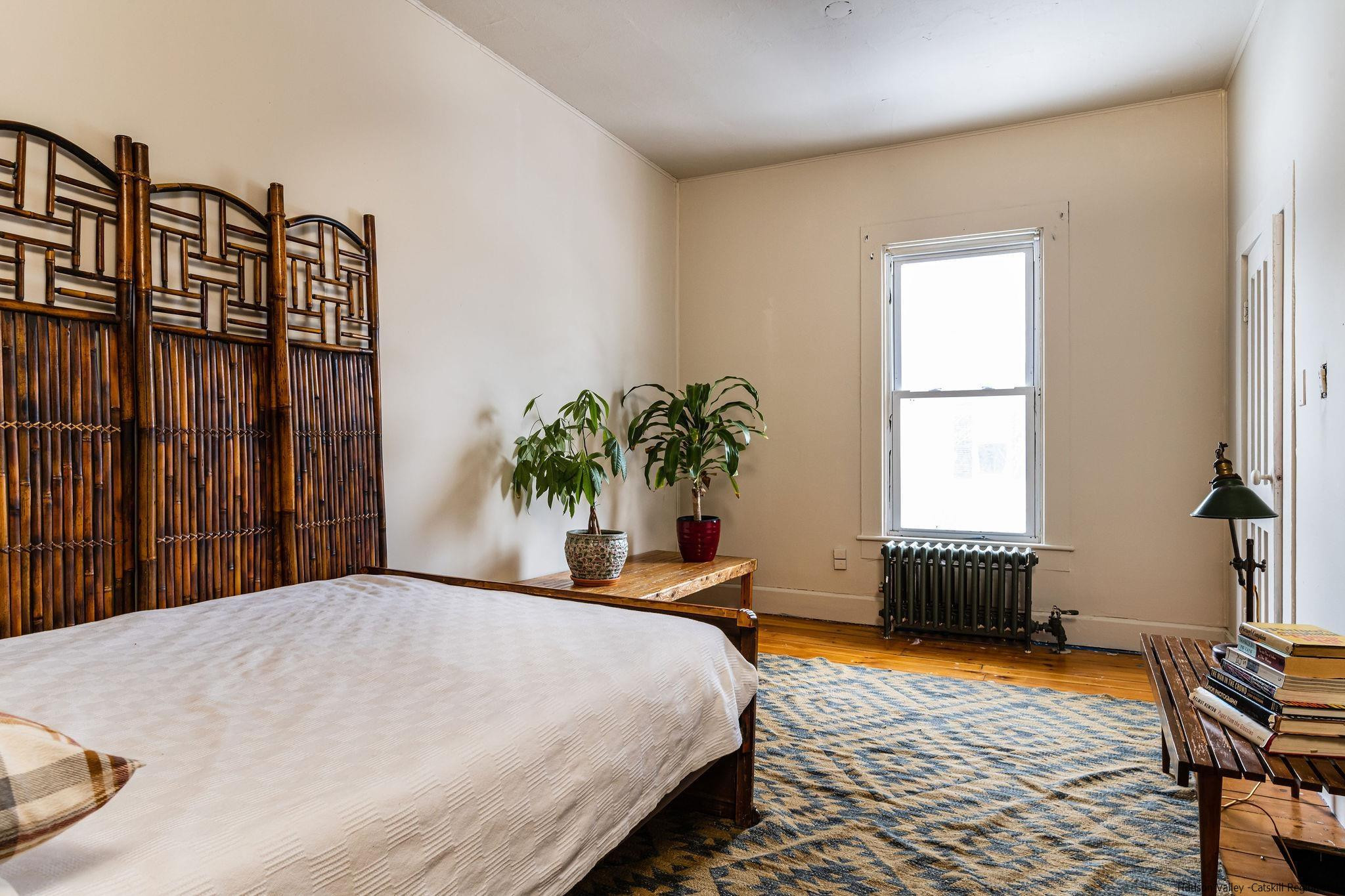 54155 Main Street Roxbury, NY 12474 - Photo 12 of 20 a bedroom with a bed and a window