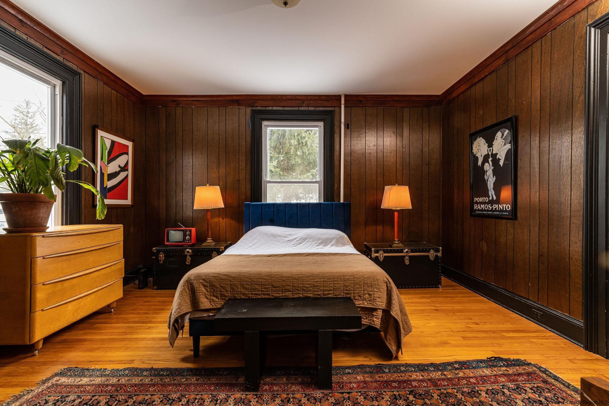 54155 Main Street Roxbury, NY 12474 - Photo 7 of 20 a bedroom with a bed and a dresser next to a window