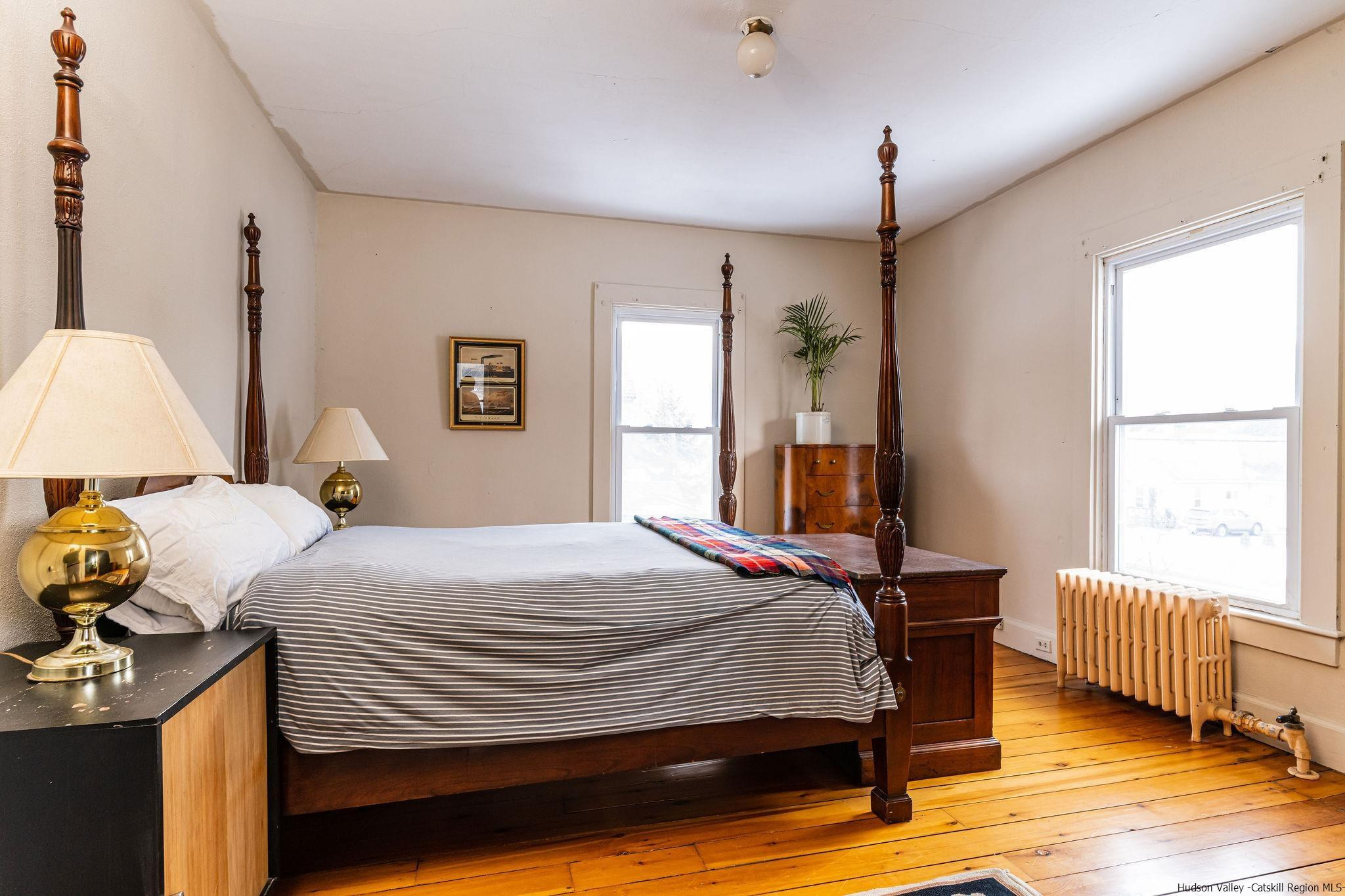 54155 Main Street Roxbury, NY 12474 - Photo 10 of 20 a bedroom with a bed and wooden floor