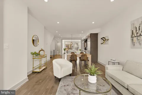 a living room with furniture and a table