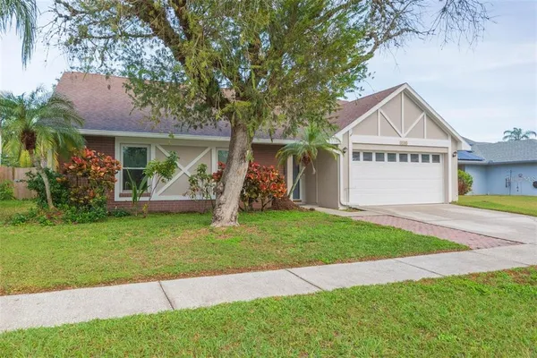 a front view of house with yard and outdoor seating