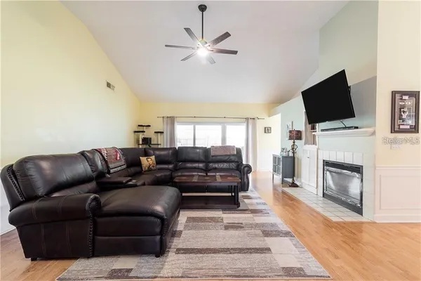 a living room with furniture and a flat screen tv