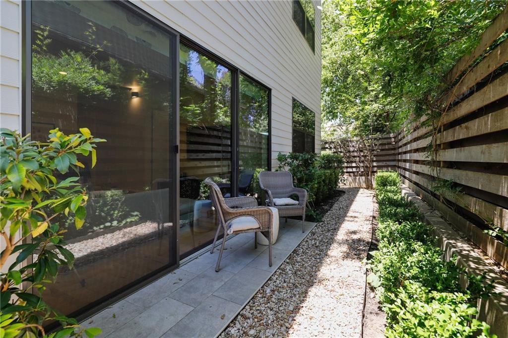 2314 Enfield Road, Unit 100 Austin, TX 78703 - Photo 1 of 1 a view of a house with backyard sitting area and garden