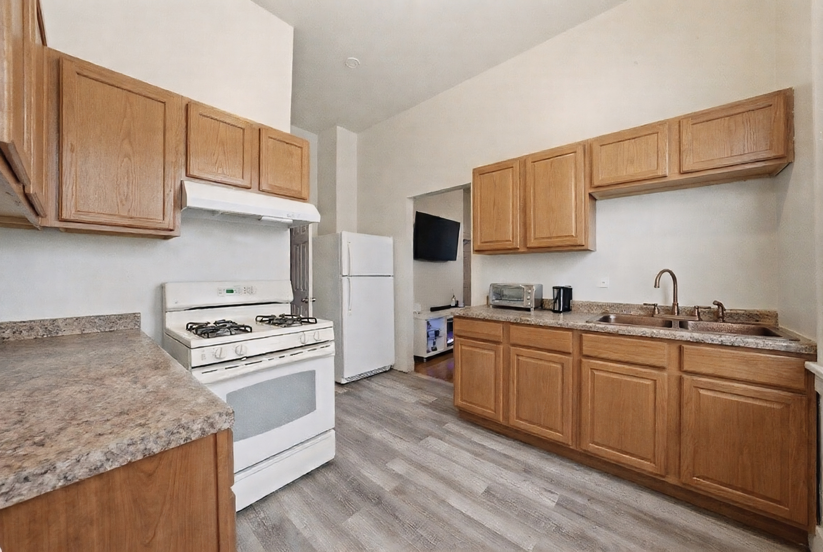 11735 South Indiana Avenue Chicago, IL 60628 - Photo 15 of 26 a kitchen with stainless steel appliances granite countertop a sink stove and refrigerator