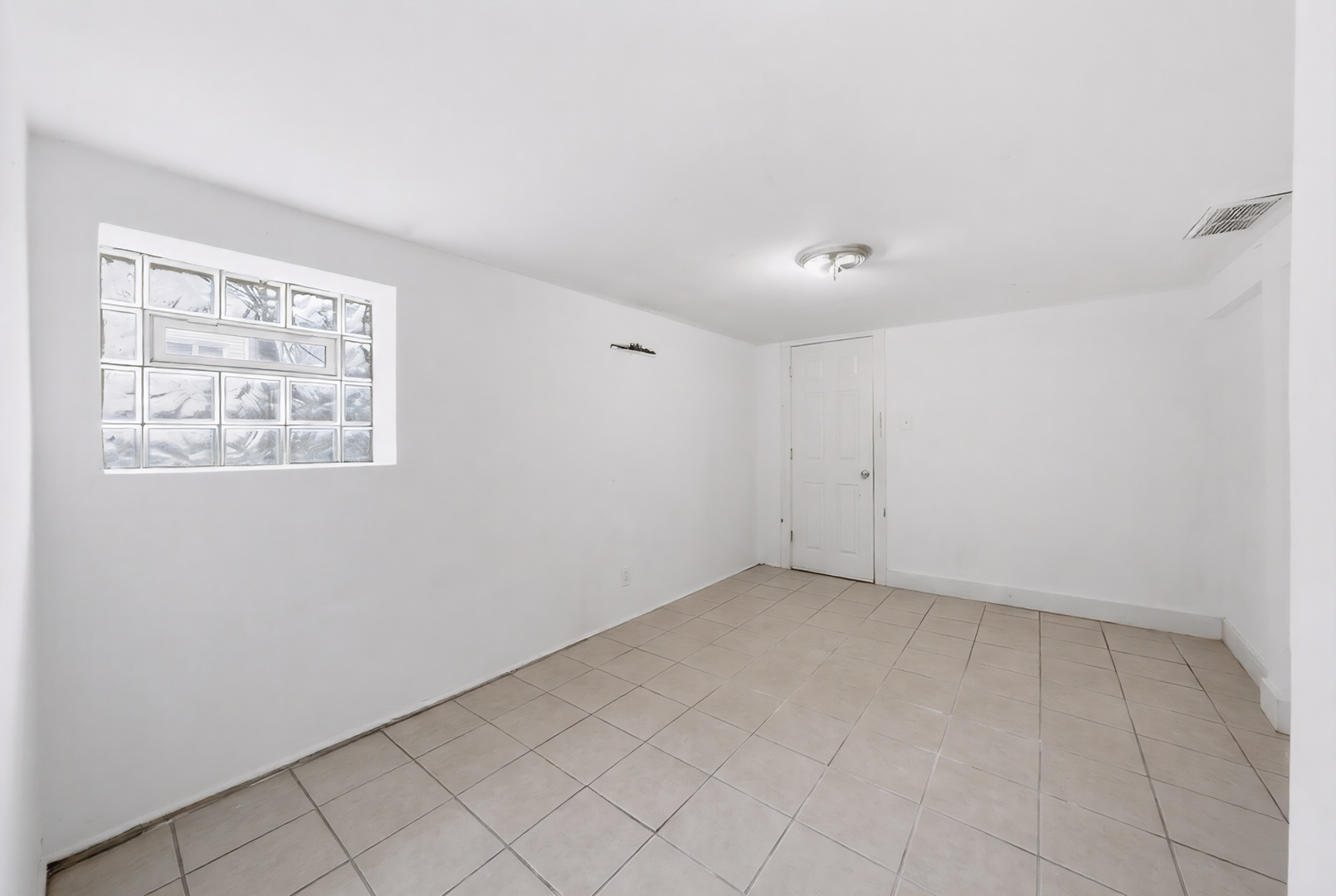 11735 South Indiana Avenue Chicago, IL 60628 - Photo 26 of 26 an empty room with windows