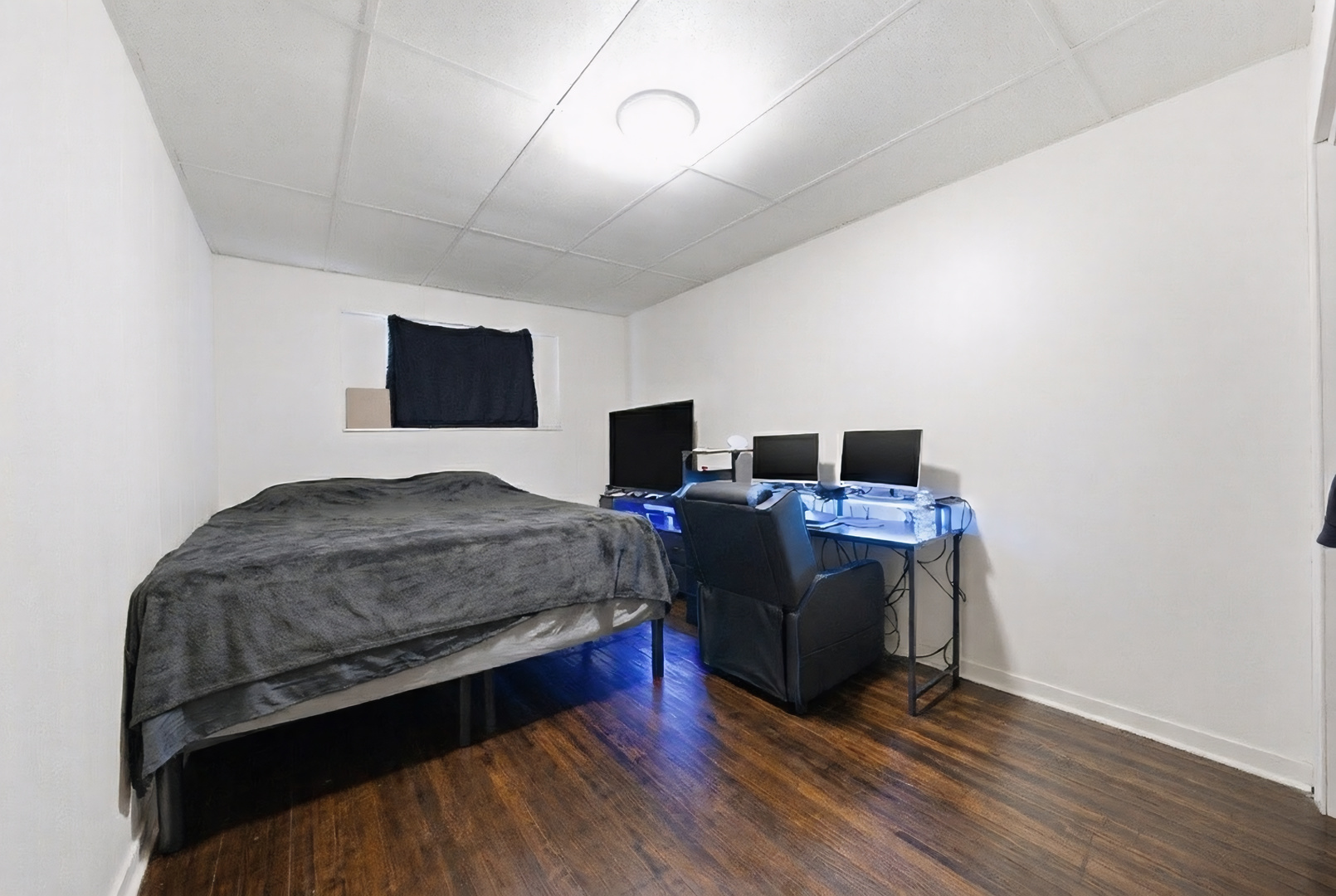 11735 South Indiana Avenue Chicago, IL 60628 - Photo 7 of 26 a bedroom with a bed and a television