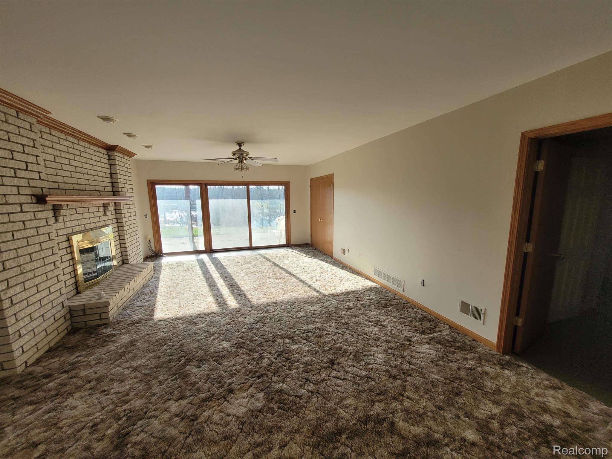 9725 Milford Road Holly, MI 48442 - Photo 19 of 28 lower level Living room with Fireplace
