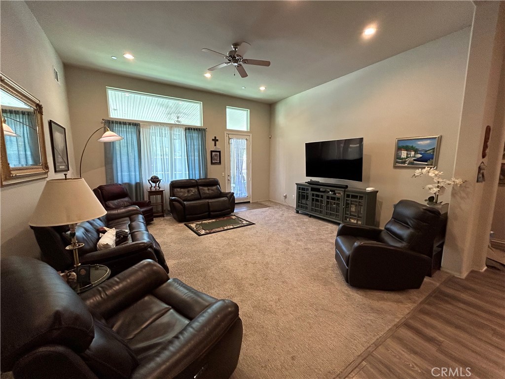 30099 Whembly Circle Menifee, CA 92584 - Photo 18 of 42 a living room with furniture and a flat screen tv