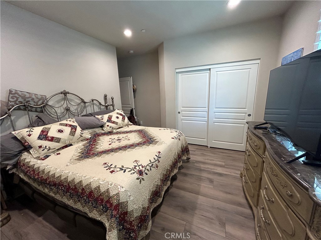 30099 Whembly Circle Menifee, CA 92584 - Photo 20 of 42 a bedroom with a bed and a dresser