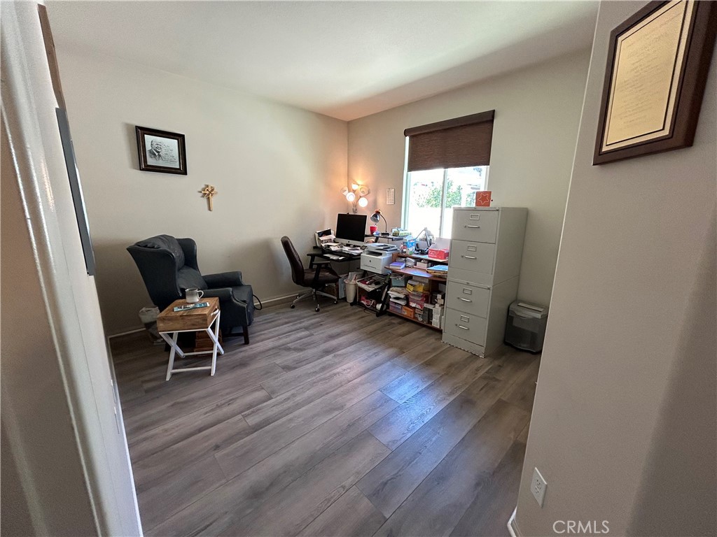 30099 Whembly Circle Menifee, CA 92584 - Photo 21 of 42 a living room with furniture and a wooden floor