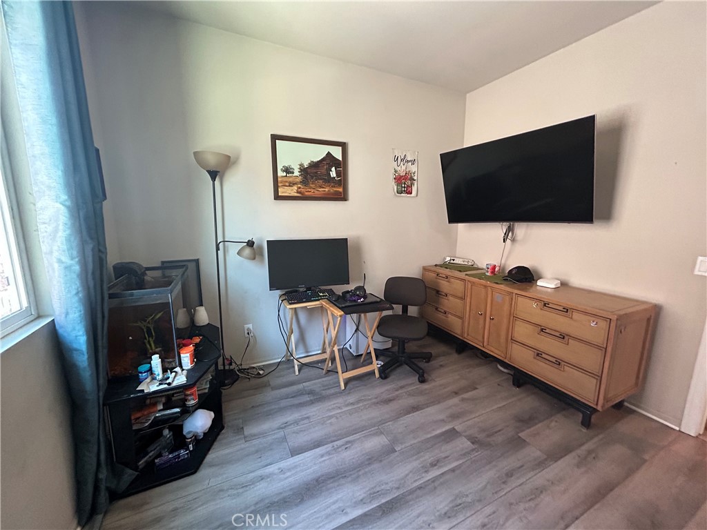 30099 Whembly Circle Menifee, CA 92584 - Photo 26 of 42 a living room with furniture and a flat screen tv