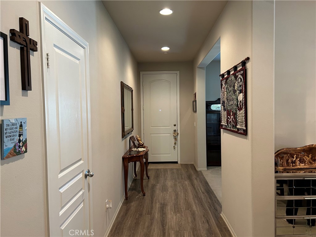 30099 Whembly Circle Menifee, CA 92584 - Photo 5 of 42 a view of hallway with wooden floor